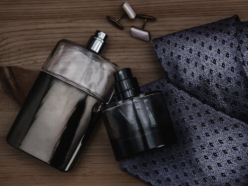 nice looking cologne bottles and dark grey color tie