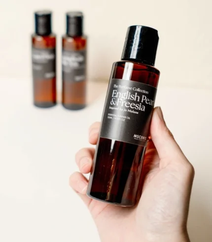 Hand Holding MScents English Pear Freesia Essential Purifier Oil