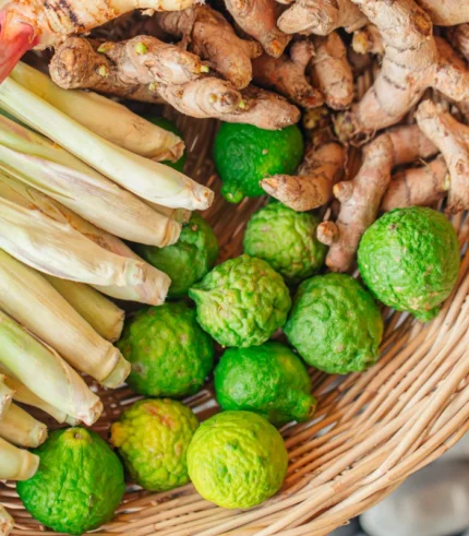 wooden basket with green lime ginger lemon grass