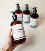 Hand Holding MScents Resonance Aromatherapy Handsoap Bottle