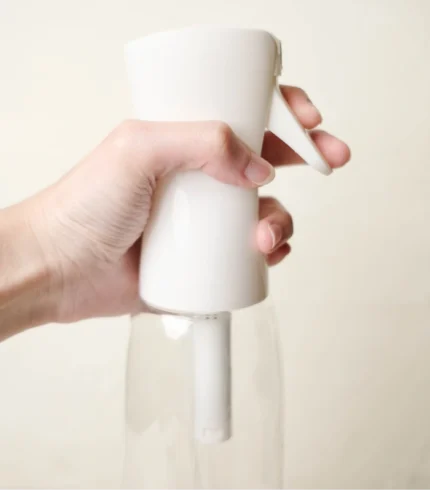 Hand Holding MScents Nano Spray Bottle
