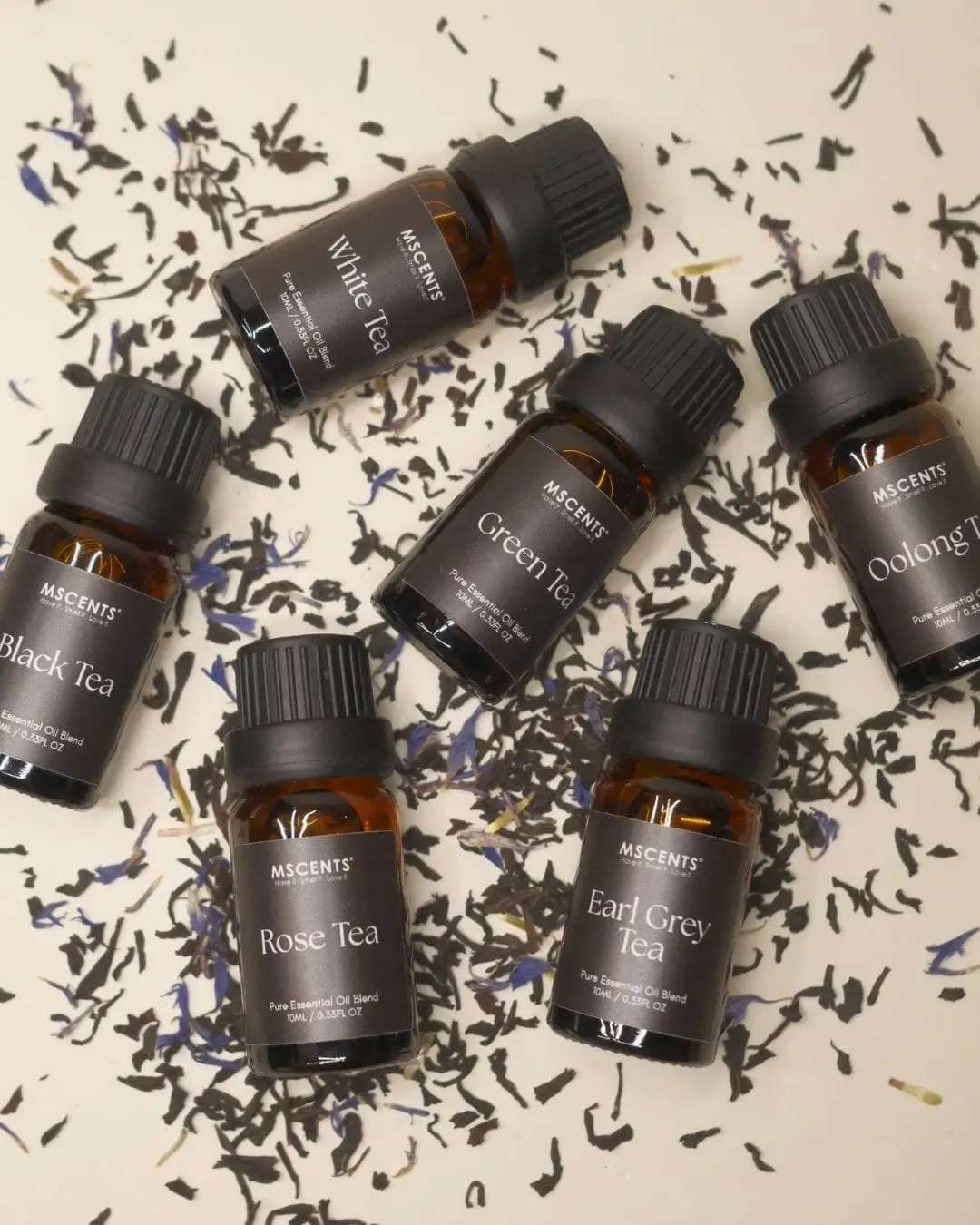 Top view 5 bottles of MScents tea collection pure essential oil