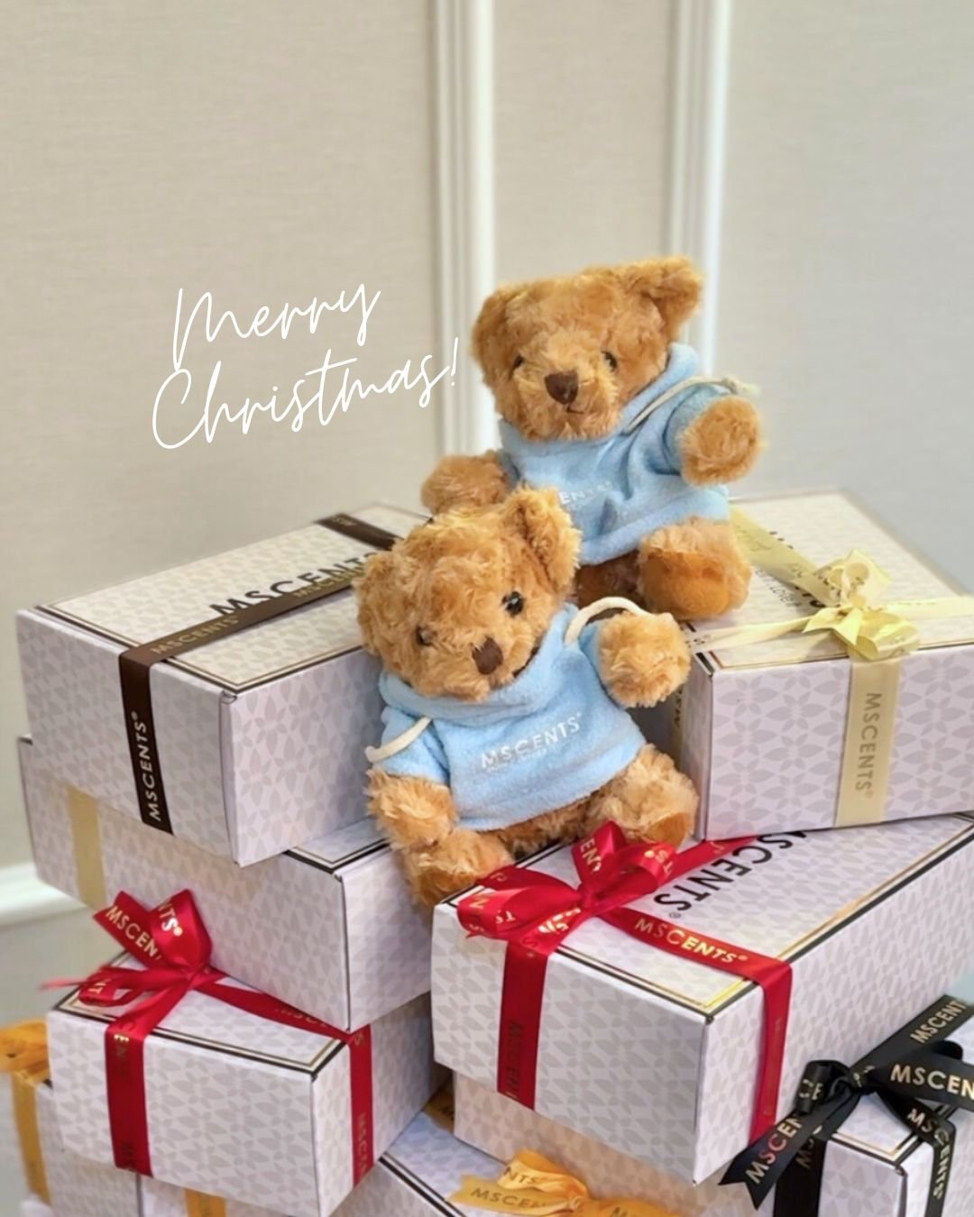 Boxes of scent gifts with a teddy bear on top