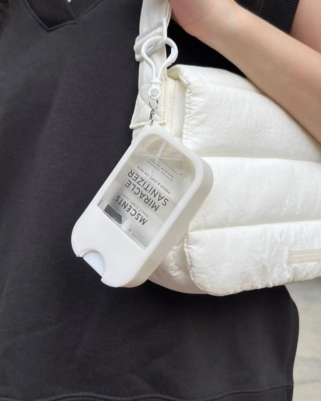 MScents hand sanitizer attached to a white bag