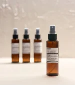 MScents mosquito repellent bottle front & 3 bottles background