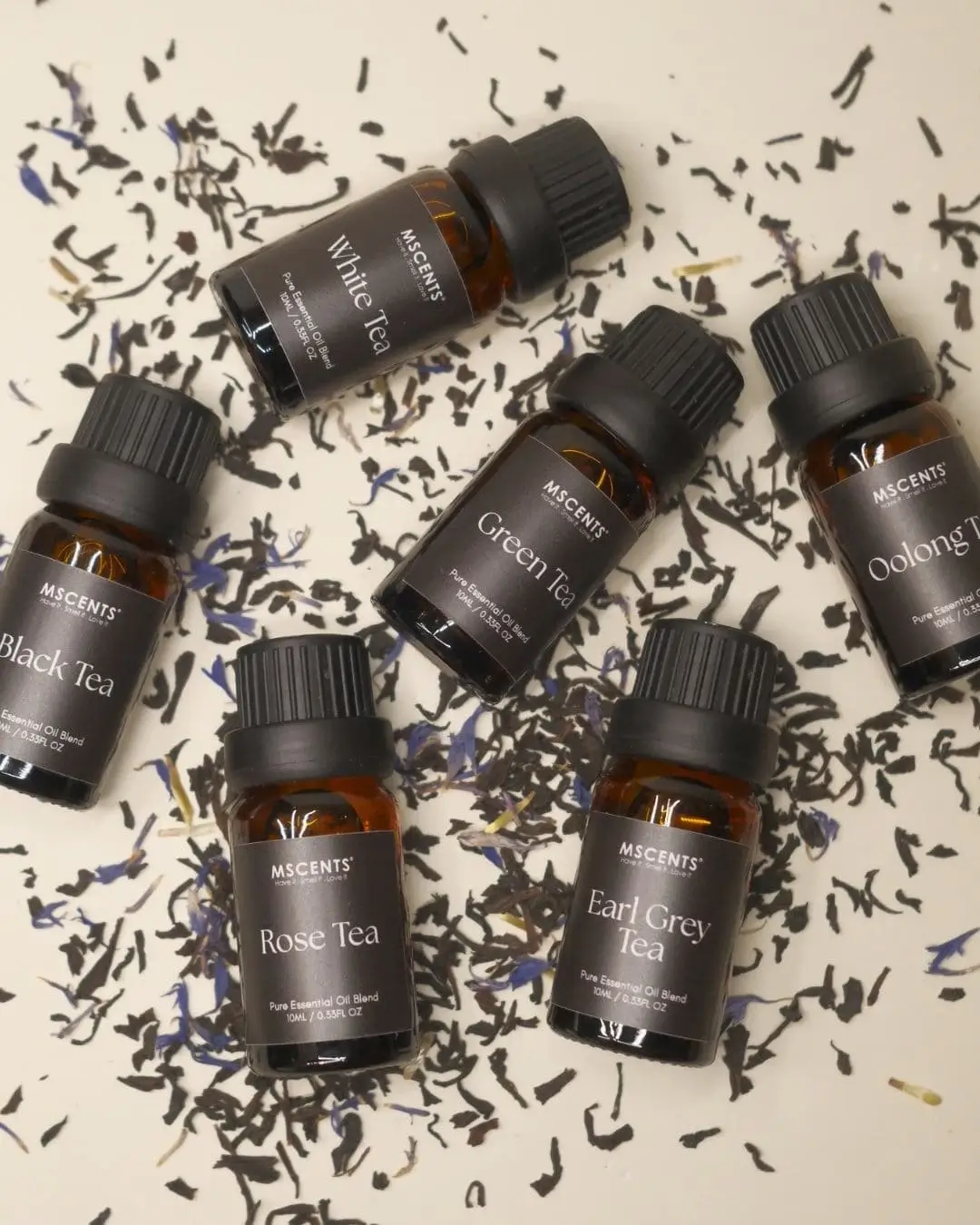 MScents pure essential oil tea collection bottles scattered