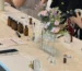 Women sitting at a long table during perfume-making class