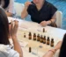 Women in a perfume-making class smelling scents
