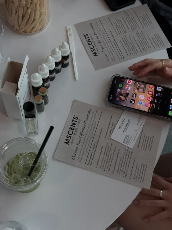 A woman reading the MScents event guide in the table
