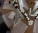 eople at an event doing a perfume-making workshop with small bottles on the table
