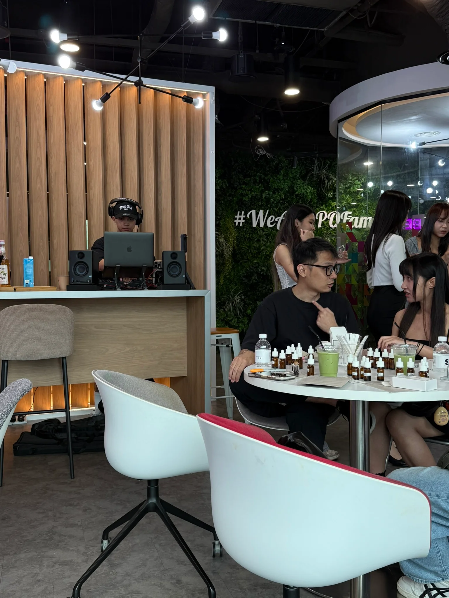 People-attending-an-event-while-participating-in-a-perfume-making-class